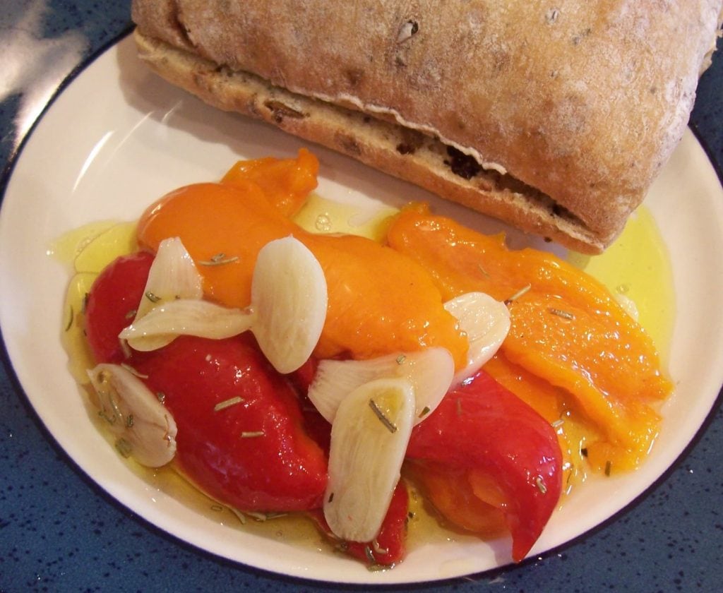 Homemade roasted marinated peppers with bread