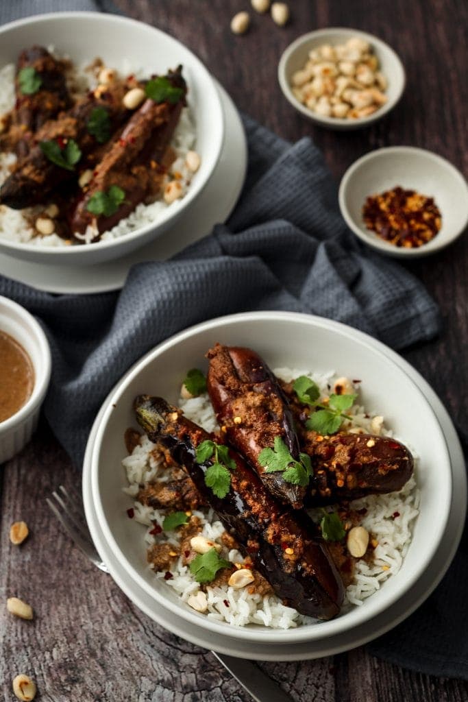 two bowls of stuffed aubergine curry