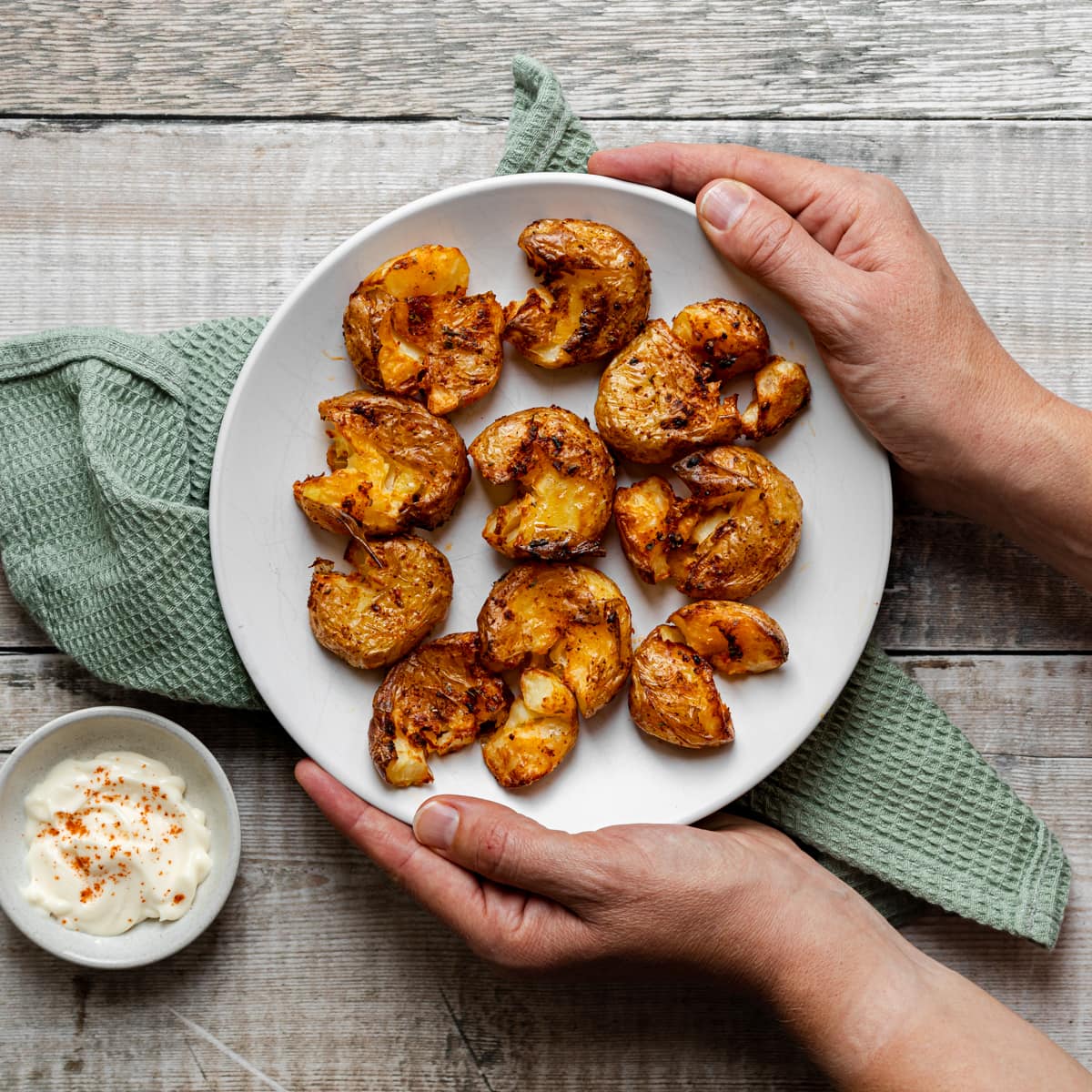plate of crushed air fryer potatoes