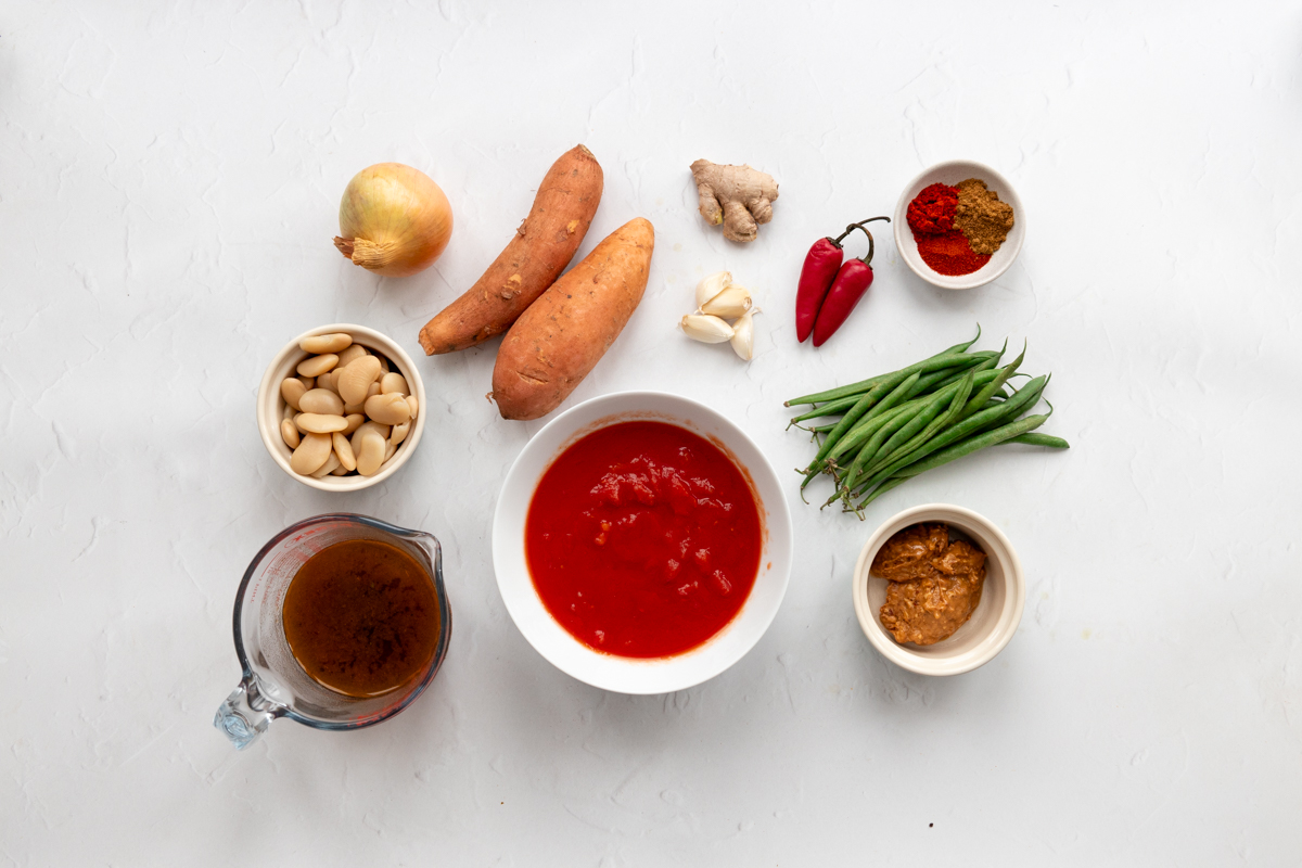 Ingredients for African peanut stew with sweet potato and butter beans