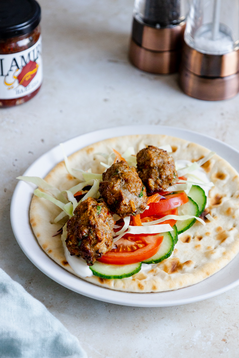 Air fried harissa lamb koftas on a flatbread